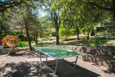 a ping pong table in the middle of a park at Résidence U Pirellu in Porto-Vecchio