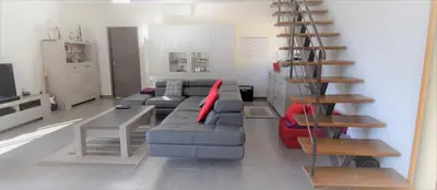 a living room with a couch and a table at A Casa Di Campa in Oletta