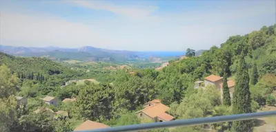 a view of a valley with houses and trees at A Casa Di Campa in Oletta