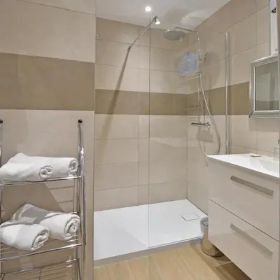 a bathroom with a shower and a sink at Bungalows Du Maquis in Porto-Vecchio