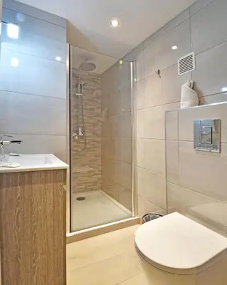 a bathroom with a shower and a sink at Bungalows Du Maquis in Porto-Vecchio