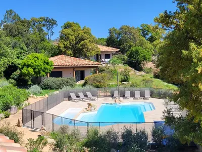 a house with a swimming pool in a yard at Villas Lantana in Porto-Vecchio