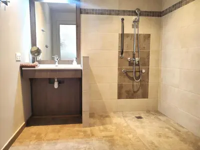 a bathroom with a shower and a sink at Villas Lantana in Porto-Vecchio