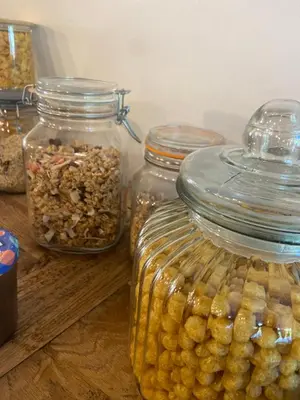 a group of jars of food sitting on a table at Hôtel U Frascone in Venaco