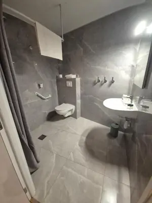 a bathroom with a toilet and a sink at Casa Marana by Le Lido in Lucciana