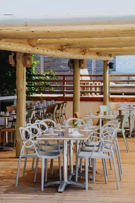 a group of tables and chairs on a patio at Casa Marana by Le Lido in Lucciana
