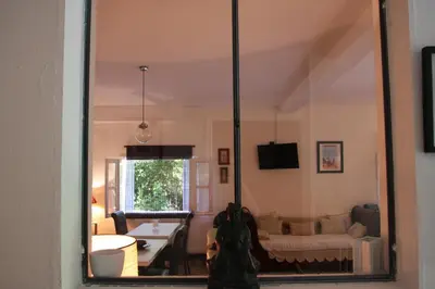 a mirror reflection of a living room with a couch at 1er Consul SAS a Bussinca in Bocognano