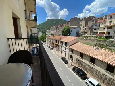 a view of a city street from a balcony at Pascal Paoli in Corte
