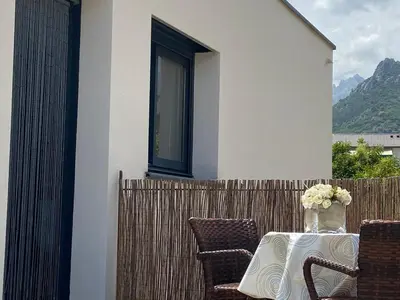 a table with a vase of flowers on a fence at Casa Inde Noi in Corte