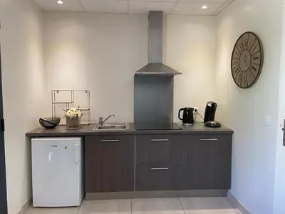 a kitchen with a sink and a stove top oven at Casa Inde Noi in Corte