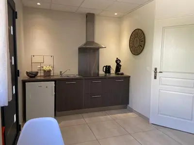 a kitchen with a sink and a stove at Casa Inde Noi in Corte