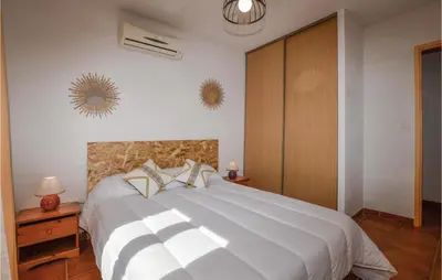 a bedroom with a large white bed with two pillows at Nice Home In Casalabriva With Wifi in Casalabriva