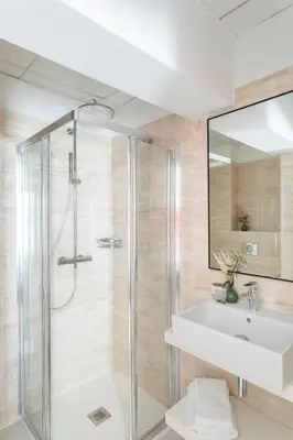 a bathroom with a shower and a sink at Les Roches Blanches in Porto-Vecchio