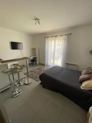 a bedroom with a bed and a desk with a computer at Panate in Corte