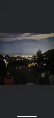 a view of a city at night with lights at Residence Paradisu Ajaccio in Appietto