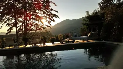 a swimming pool with a view of a mountain at Casa Santa Lucia in Bocognano