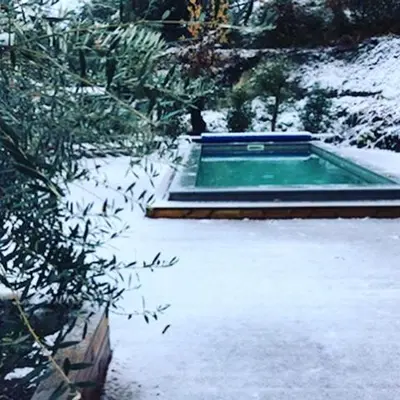 a swimming pool with snow on the ground at Casa Santa Lucia in Bocognano