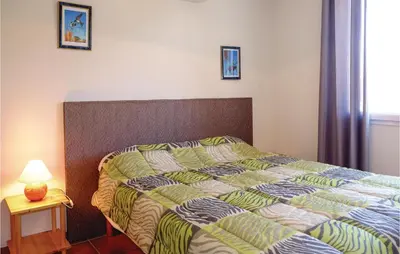 a bedroom with a bed and a lamp on a table at Beautiful Home In Casalabriva With Wifi in Casalabriva