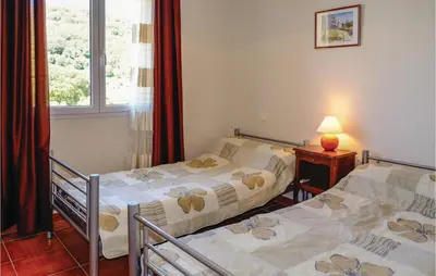 two twin beds in a room with a window at Beautiful Home In Casalabriva With Wifi in Casalabriva