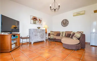 a living room with a couch and a tv at Beautiful Home In Casalabriva With Wifi in Casalabriva