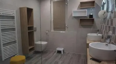 a bathroom with a toilet and a sink and a shower at L'appollu in La Porta