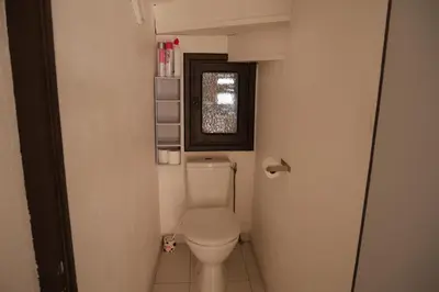 a small bathroom with a toilet and a window at A Cittadella in Vico