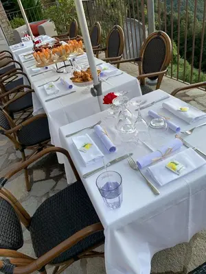 a long white table with plates of food on it at Casa Di Lucia Mi-Hotel in Mazzola