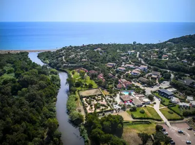 an aerial view of a town next to a river at Hotel Olmuccio in Sainte-Lucie de Porto-Vecchio