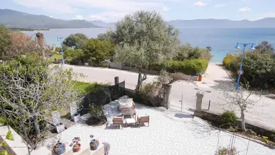 an overhead view of a patio with a view of the water at Les Figuiers in Porto Pollo