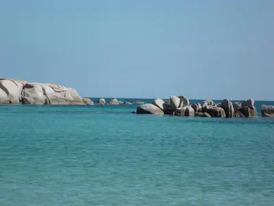 a group of rocks in the water at Villa Cartarana in Bonifacio