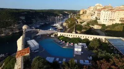 an aerial view of a resort with a marina at Hotel Spa Genovese in Bonifacio