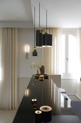 a rendering of a kitchen with a table and stools at Hotel Spa Genovese in Bonifacio