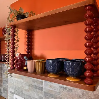 a shelf with bowls on top of a wall at Domaine Colonna-Santini Gîte avec Piscine & Spa, Vue Mer et Montagnes in Porri