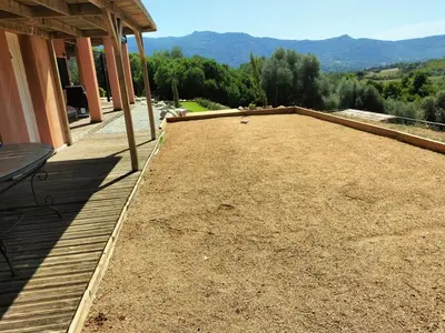 a large patio with a view of the mountains at les JARDINS de PRATAVONE in Aja dʼOnica