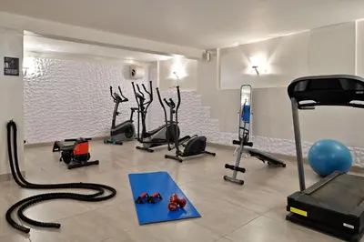 a gym with several treadmills and a treadmill at U Paesolu in Sainte-Lucie de Porto-Vecchio