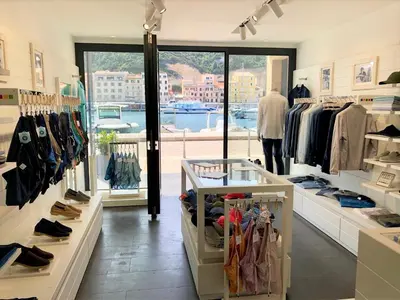 a clothing shop with a view of the water at Hotel Centre Nautique in Bonifacio