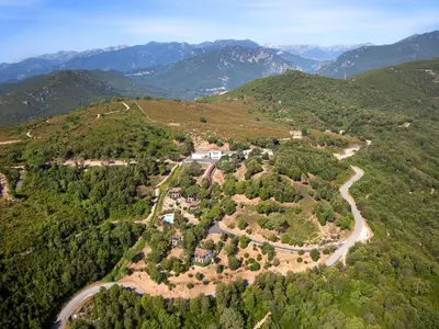an aerial view of a winding road in the mountains at Holiday Home A Mandria by Interhome in Ghisoni
