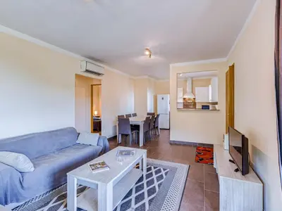 a living room with a couch and a table at Holiday Home A Mandria by Interhome in Ghisoni