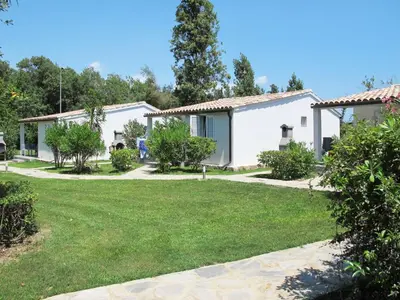 a house with a yard in front of it at Holiday Home A Suara-1 by Interhome in Ghisonaccia