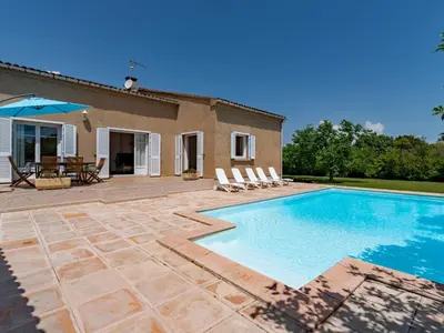 a villa with a swimming pool and a patio at Holiday Home Casella by Interhome in Prunelli-di-Fiumorbo