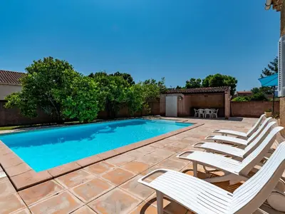 a patio with chairs and a swimming pool at Holiday Home Casella by Interhome in Prunelli-di-Fiumorbo
