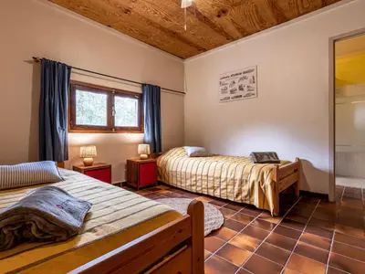 a bedroom with two beds and a window at Holiday Home Svyntha by Interhome in Prunelli-di-Fiumorbo