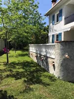 a wall next to a house with a tree at Apartment Casa Antoinette by Interhome in Prunelli-di-Fiumorbo