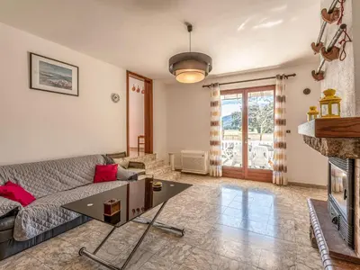 a living room with a couch and a fireplace at Apartment Casa Antoinette by Interhome in Prunelli-di-Fiumorbo