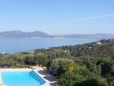 a swimming pool with a view of the water at Hotel Celine in Coti-Chiavari