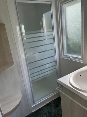 a bathroom with a shower and a sink at Les Bergeries de Petralonga in Sotta