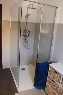 a shower with a glass door in a bathroom at Casa Nelly in Porticcio