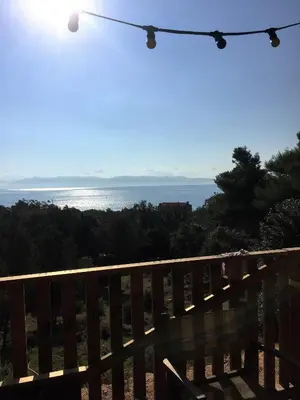 a view of the ocean from the deck of a house at Tente Lodge Bord de Mer in Coti-Chiavari