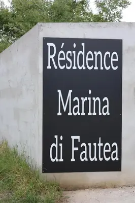 a sign that reads residence mariana del filde at Marina Di Fautea in Olmucciu