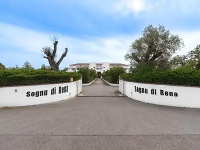 a road with two barriers that say scotch at hair and sound at home at Vacancéole - Résidence Sognu di Rena in San-Nicolao